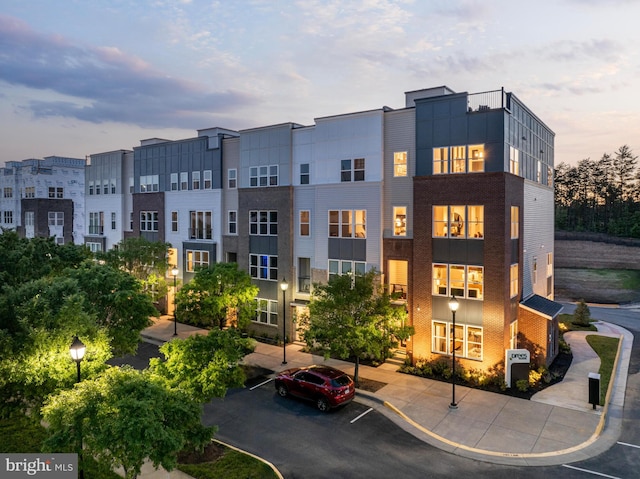 view of outdoor building at dusk