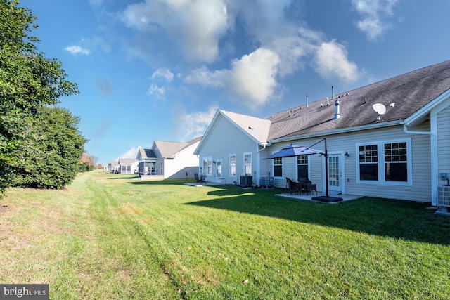 view of yard with a patio and central AC