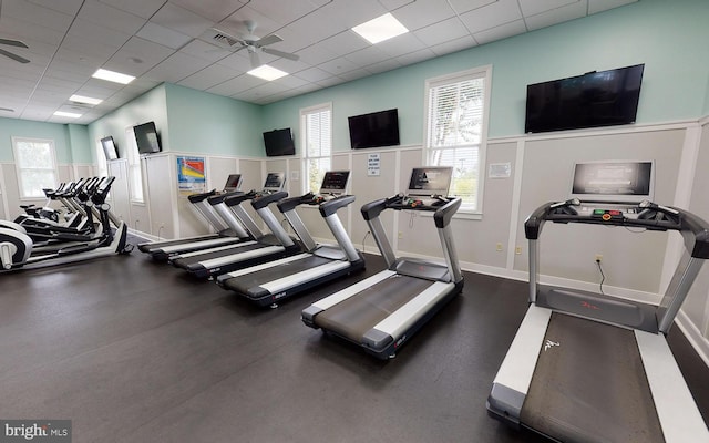 workout area with a drop ceiling and ceiling fan