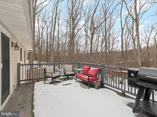 snow covered deck featuring grilling area