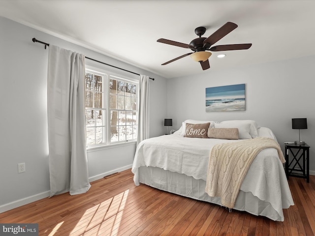 bedroom featuring ceiling fan and hardwood / wood-style flooring