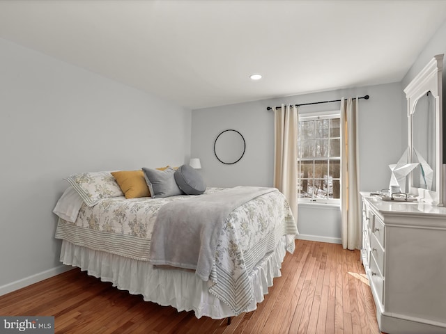 bedroom with hardwood / wood-style flooring