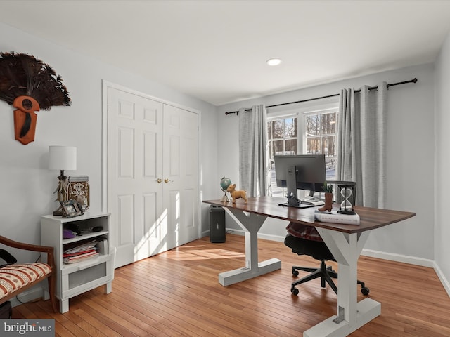 office space with wood-type flooring