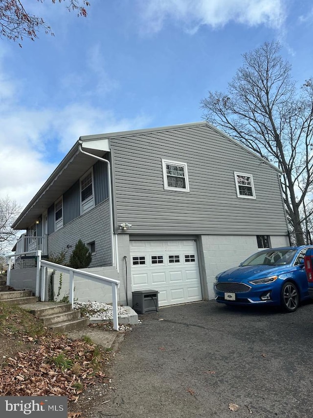 view of side of home with a garage