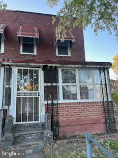 454 Roundview Rd, Baltimore, MD 21225 - view of front of house featuring entry steps and brick siding