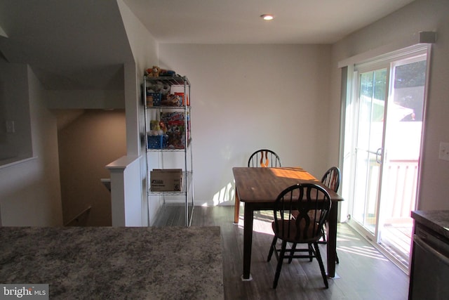 dining space with dark wood-type flooring