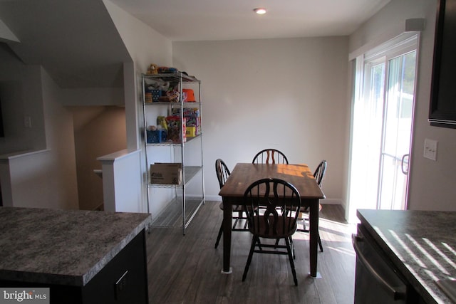 dining area with dark hardwood / wood-style floors