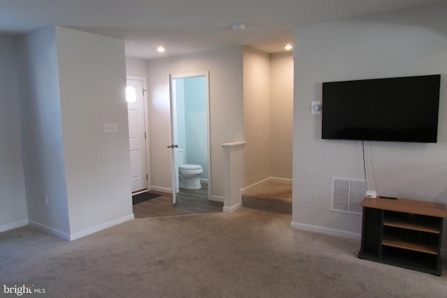 unfurnished living room with carpet floors