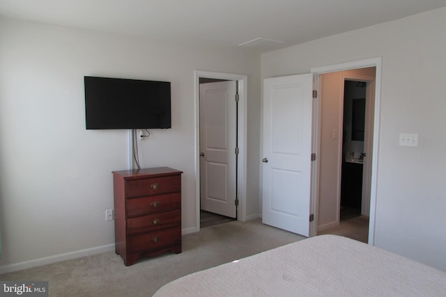 bedroom featuring light carpet