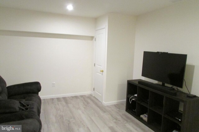 living area with light hardwood / wood-style floors