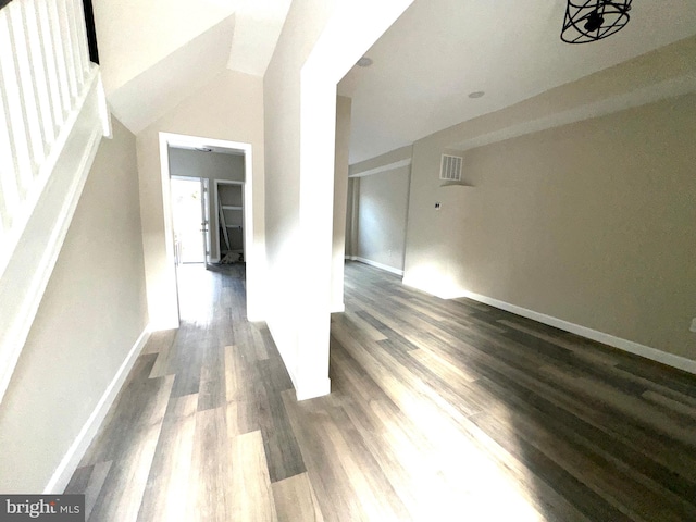 additional living space with dark wood-type flooring