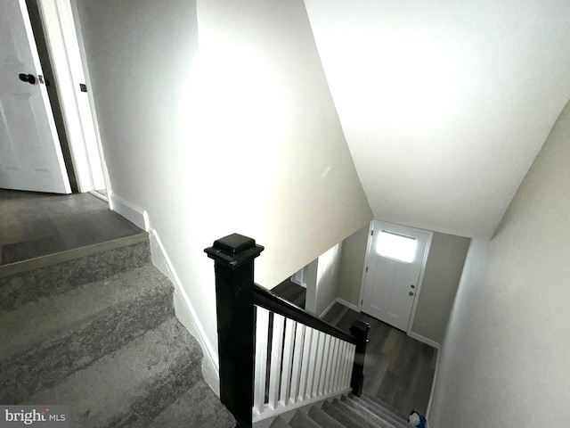 stairs with lofted ceiling