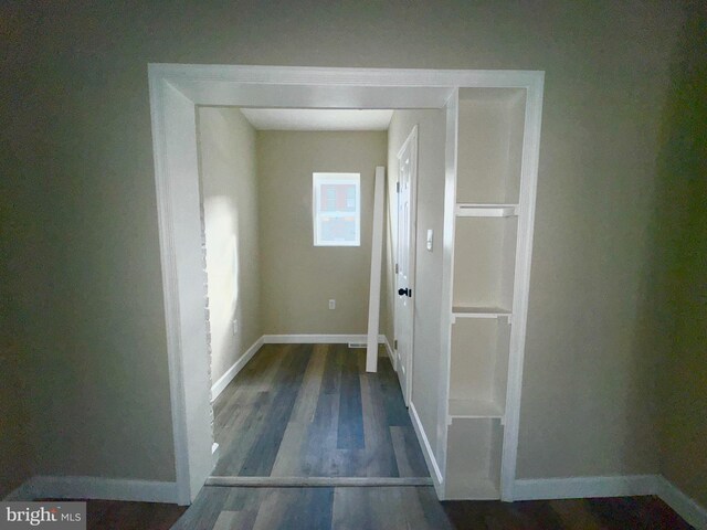 hallway featuring dark hardwood / wood-style floors