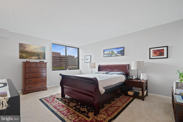 3701 S George Mason Dr Unit 1005N, Falls Church, VA 22041 - bedroom with baseboards and light carpet