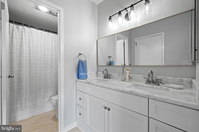 3701 S George Mason Dr Unit 1005N, Falls Church, VA 22041 - full bath featuring double vanity, a sink, shower / bath combination with curtain, and toilet