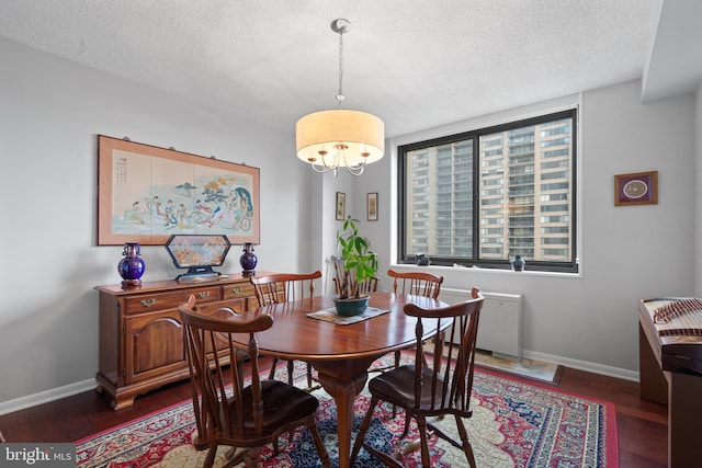 3701 S George Mason Dr Unit 1005N, Falls Church, VA 22041 - dining room with a textured ceiling, a chandelier, and baseboards