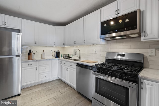 3701 S George Mason Dr Unit 1005N, Falls Church, VA 22041 - kitchen with a sink, appliances with stainless steel finishes, and white cabinetry