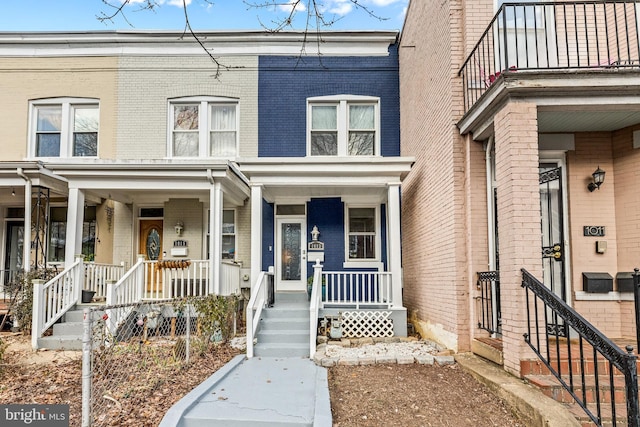 multi unit property featuring a porch