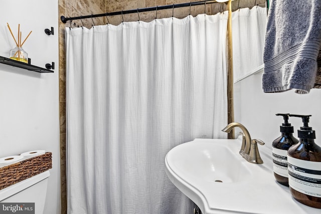 bathroom with sink and walk in shower