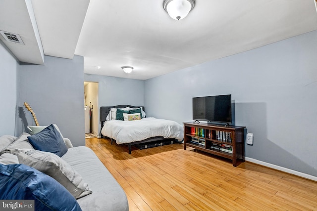 bedroom featuring wood-type flooring