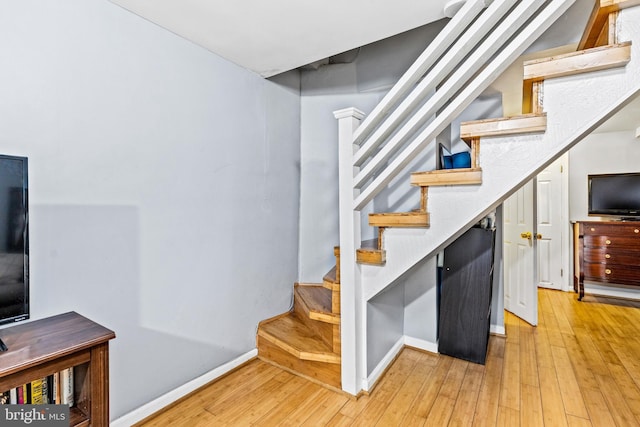 stairway featuring hardwood / wood-style floors