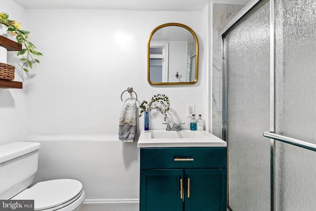 bathroom with vanity, toilet, and walk in shower