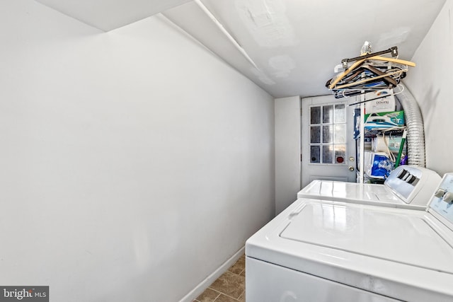 laundry room featuring separate washer and dryer and light tile patterned floors