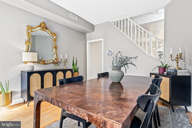 dining room with hardwood / wood-style flooring