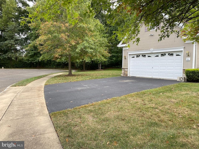 garage with a yard