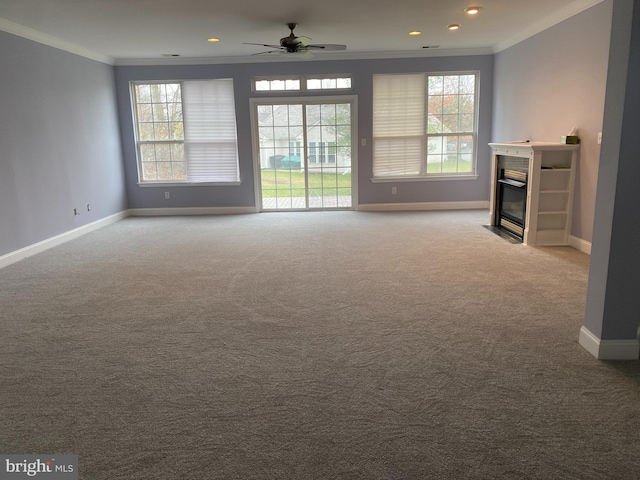 unfurnished living room with crown molding, ceiling fan, and light colored carpet