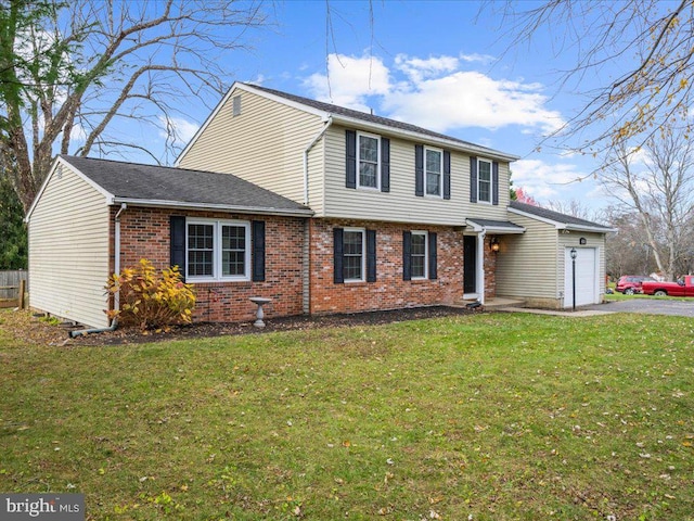 front of property featuring a front lawn and a garage