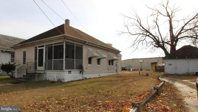 view of home's exterior featuring a lawn