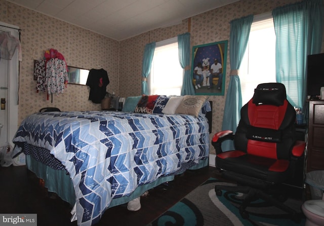 bedroom with hardwood / wood-style floors