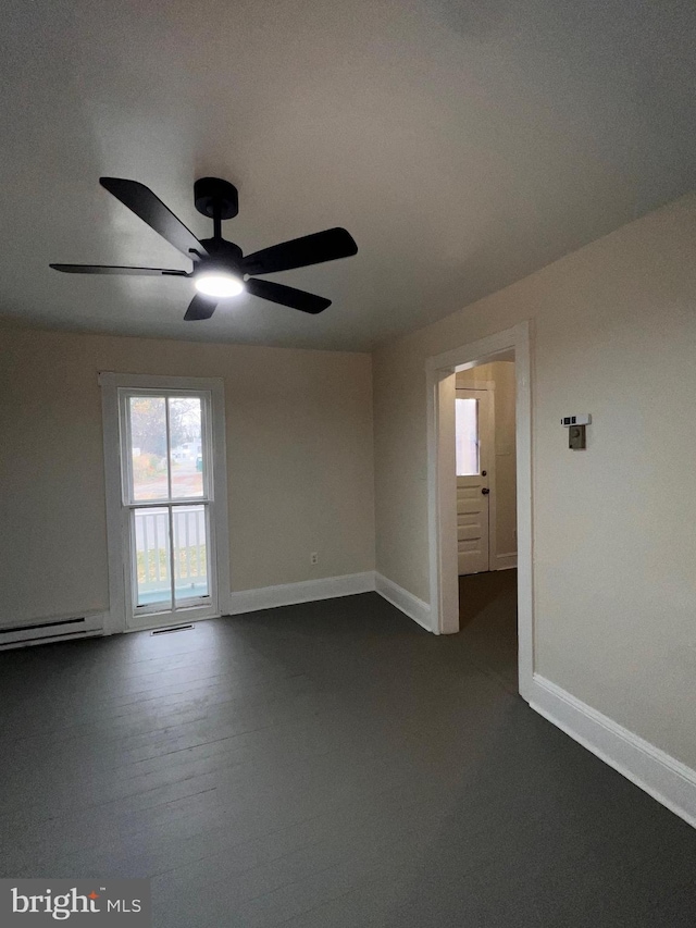 spare room with ceiling fan and wood-type flooring