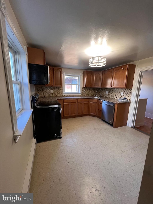 kitchen featuring decorative backsplash, range with electric cooktop, sink, and stainless steel dishwasher