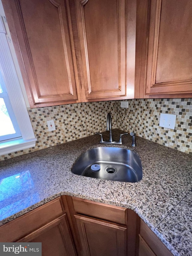 kitchen with decorative backsplash and sink