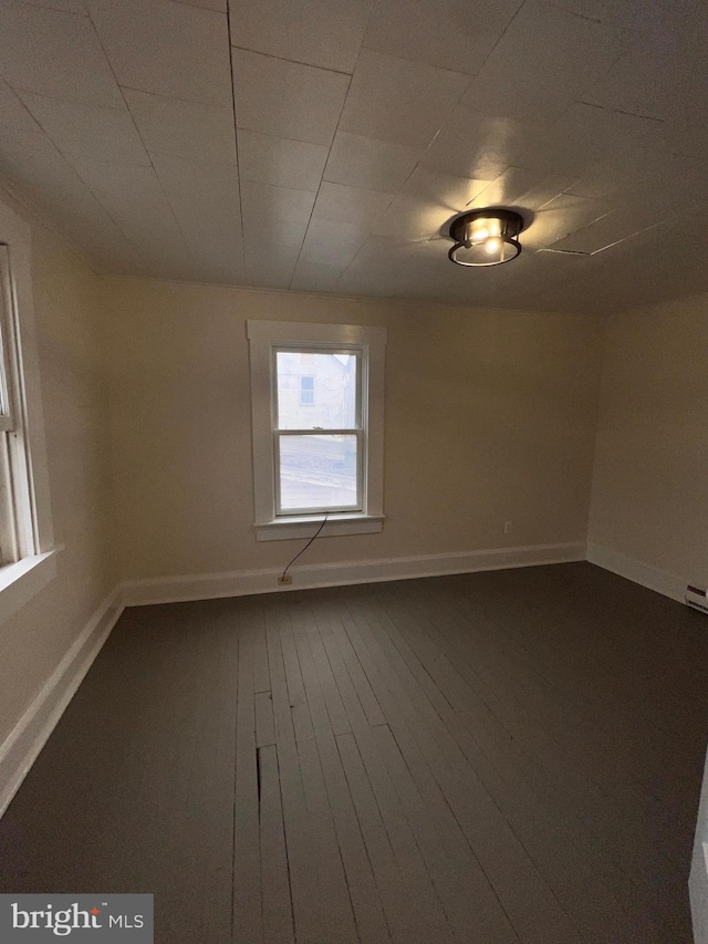 unfurnished room featuring hardwood / wood-style floors