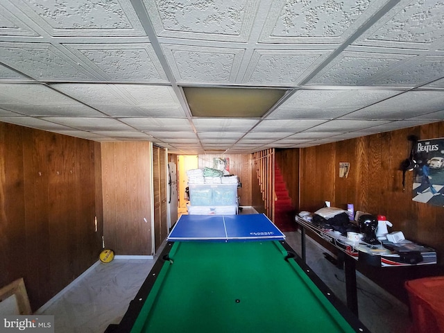 rec room featuring pool table and wood walls