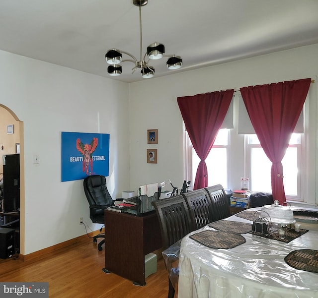 dining area featuring a chandelier and hardwood / wood-style flooring