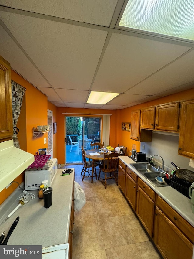 kitchen with a drop ceiling and sink