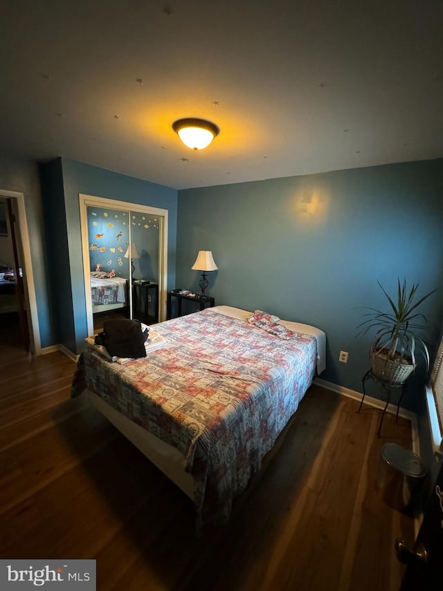 bedroom featuring dark wood-type flooring