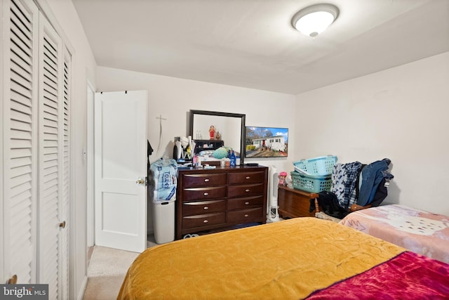 bedroom featuring light carpet