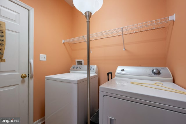 laundry area featuring washing machine and clothes dryer