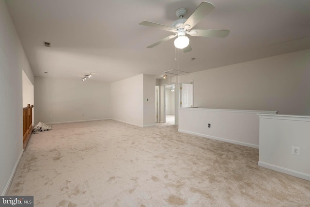 carpeted empty room with ceiling fan