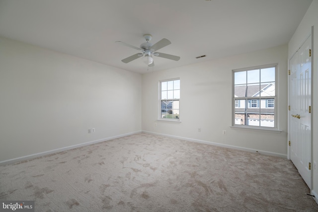 carpeted empty room with ceiling fan