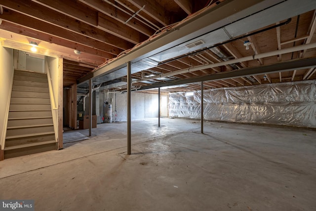 basement featuring gas water heater