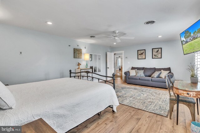 bedroom featuring hardwood / wood-style flooring and ceiling fan