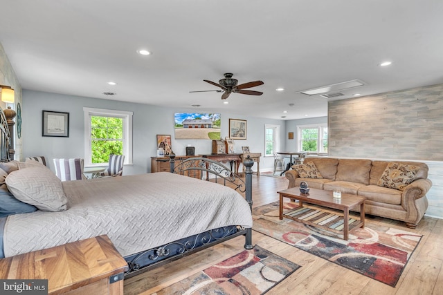 bedroom with light wood-type flooring and ceiling fan