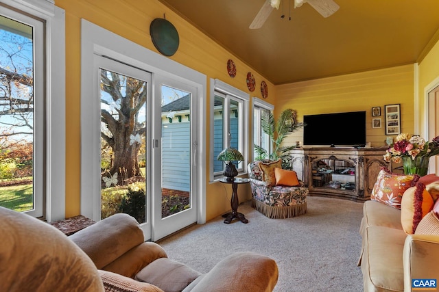 sunroom / solarium featuring ceiling fan