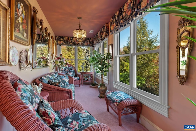 sunroom with a notable chandelier